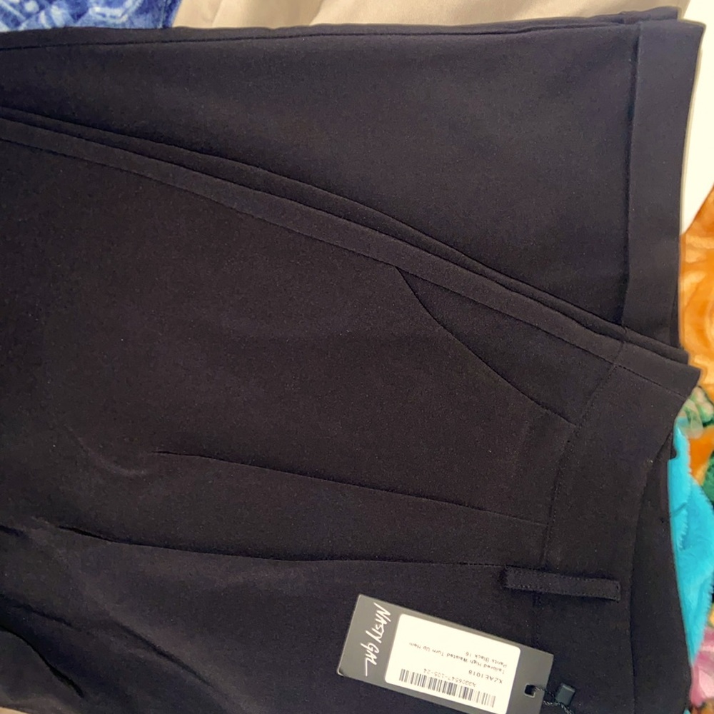 Black tailored high waisted turn up hem pants. Size 12 in US and size 16 in UK.
